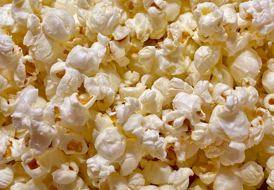 Do you put oil or butter in a popcorn machine?